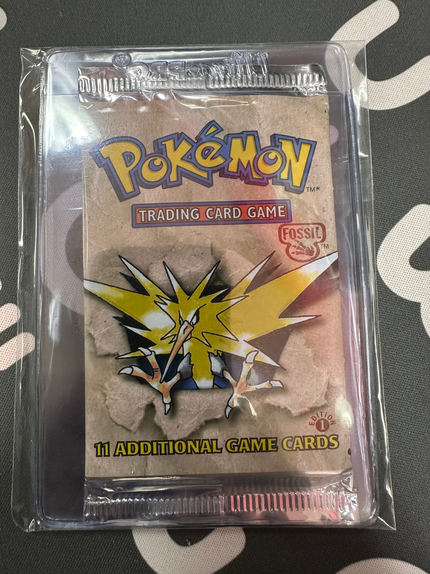Pokemon Fossil First Edition Booster Pack (Zapdos) (Assume Light)